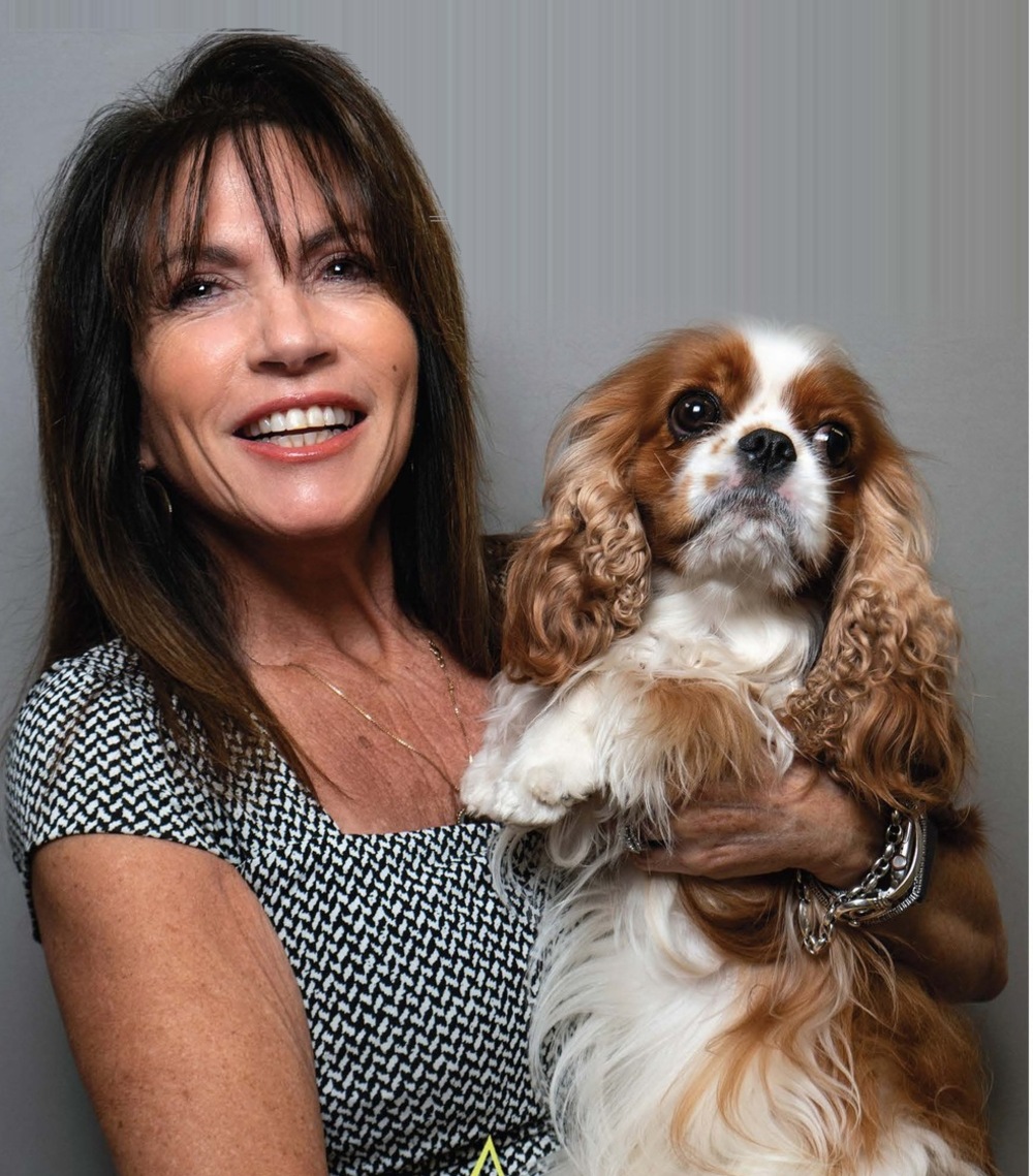 Lois Cassle, MSN, FNP-C, APRN with her spaniel